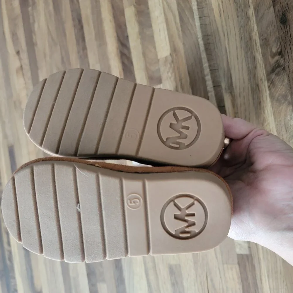 Michael Kors Yancy Girl Toddler boots featuring a brown logo print and faux fur